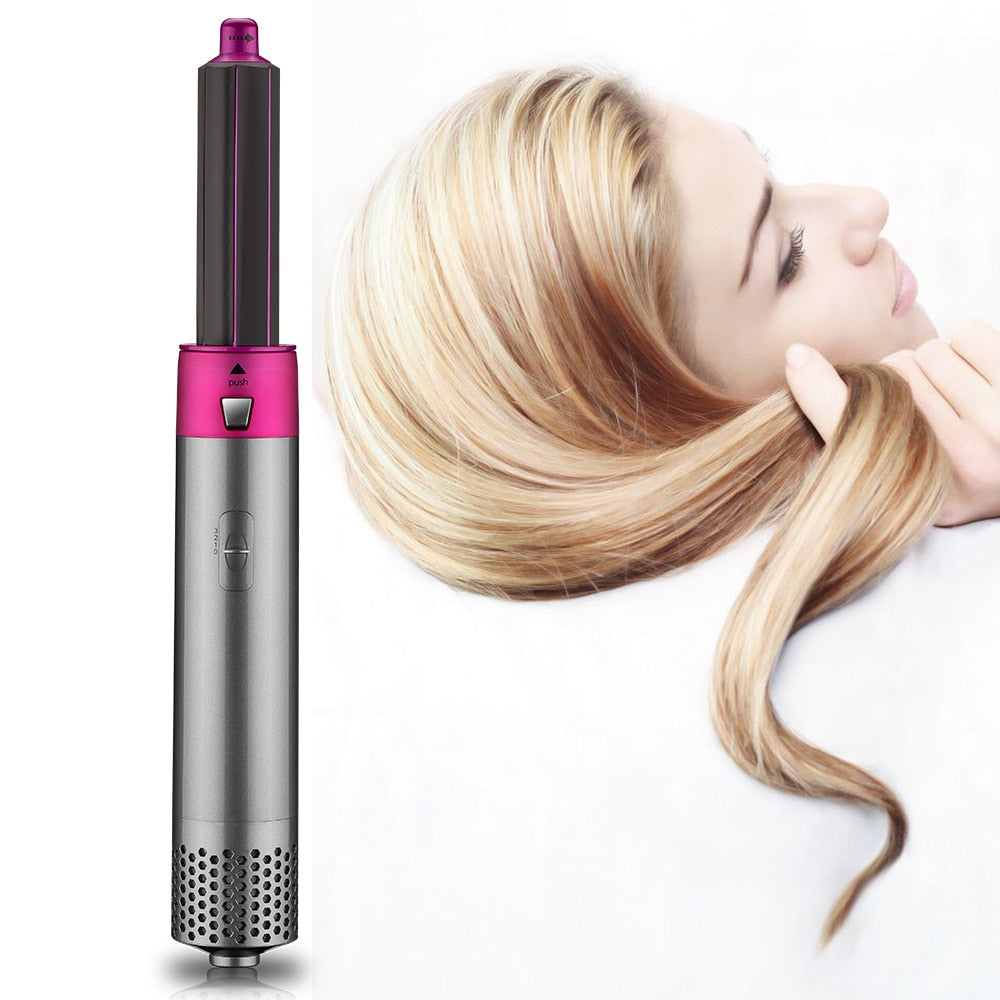 Yoyo Crown 5-in-1 professional hot-air styling brush in grey and pink, used by a woman to style her blonde hair.