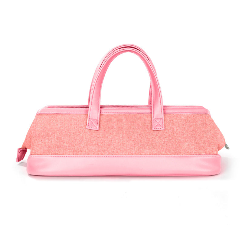 Yoyo Crown pink travel storage bag for hair dryers with a durable exterior and sturdy carrying handles.
