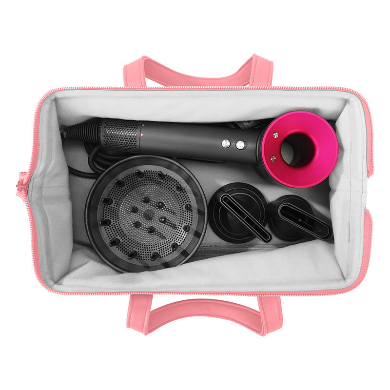Yoyo Crown pink storage bag containing a black and pink hair dryer with various attachments inside.