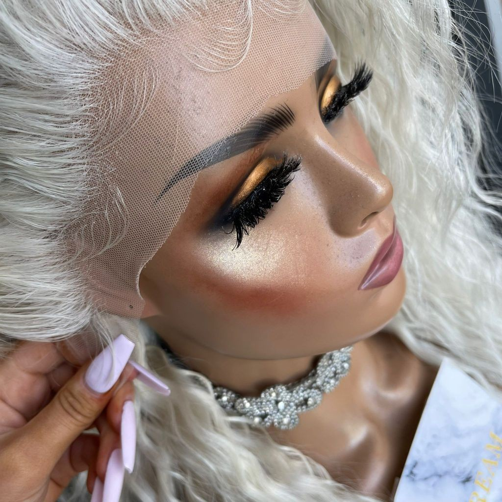 Yoyo Crown platinum blonde long wavy lace front synthetic wig on a mannequin with a natural-looking hairline.