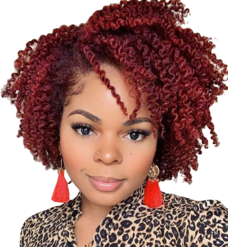 Yoyo Crown short curly red wig with small tight curls worn by a woman with a leopard print top and red tassel earrings